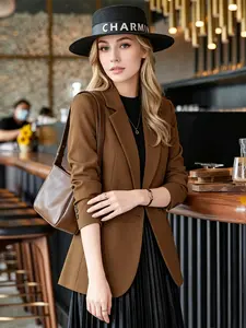 Dark brown double breasted suit jacket with three quarter sleeves and waist cinched small suit, versatile commuter women's top