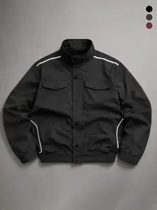 Men’s black stand-collar buttoned aviator jacket with contrasting white topstitching pocket details, loose minimalist workwear outerwear, retro urban everyday street jacket