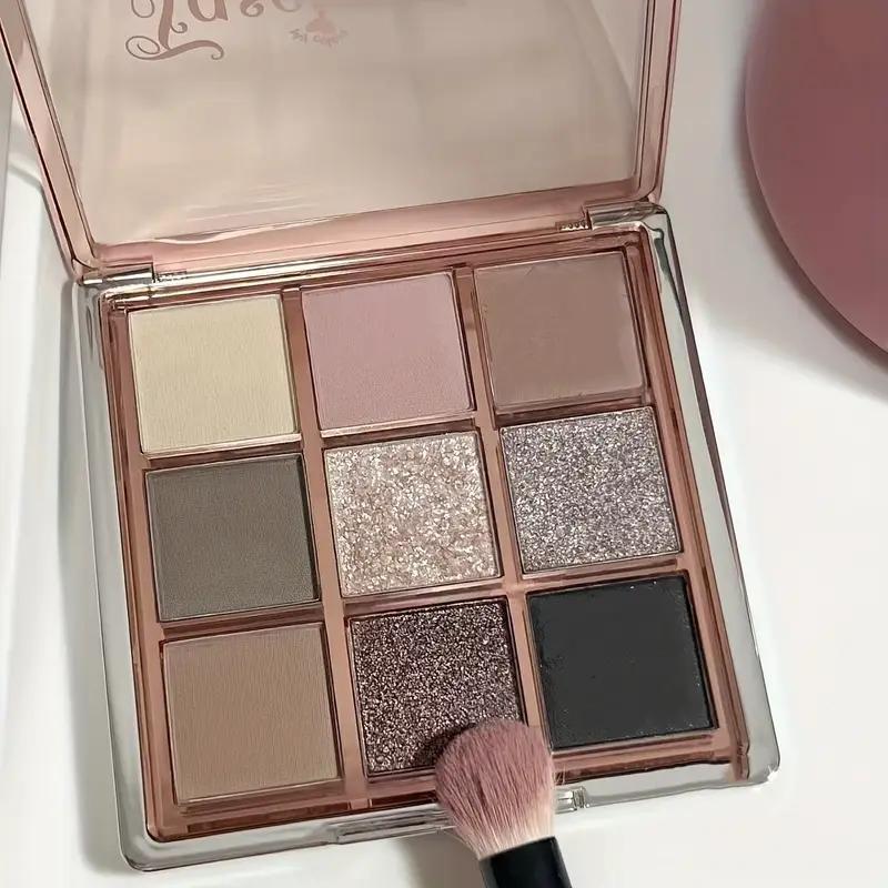 9-color eyeshadow palette - smoky gray, brown, and pink tones, featuring both matte and shimmer finishes. A versatile eyeshadow palette suitable for various makeup looks, an essential cosmetic, perfect as a Christmas gift.