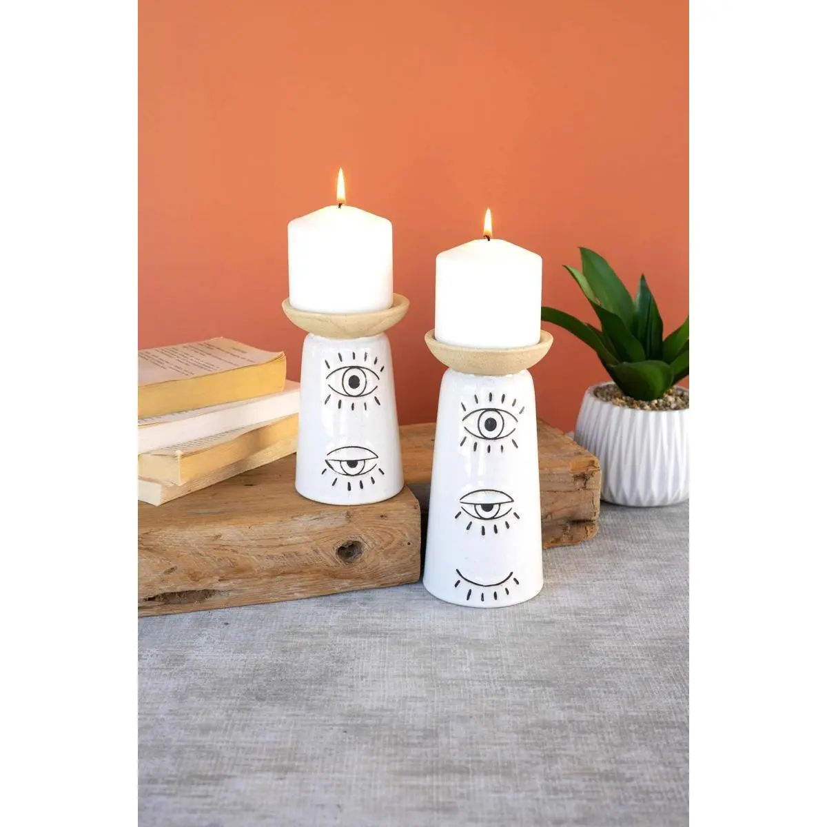 Set Of Two Ceramic Candle Holders With Eyes Detail