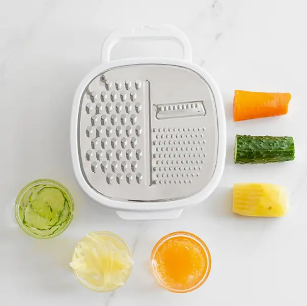 Kitchen food grater with storage box, stainless steel blade for fruit and veg prep.