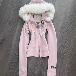 Vintage American pink faux fur hooded sweatshirt with cinched waist, Y2K cropped sweater alternative outerwear that can be worn with a raincoat
