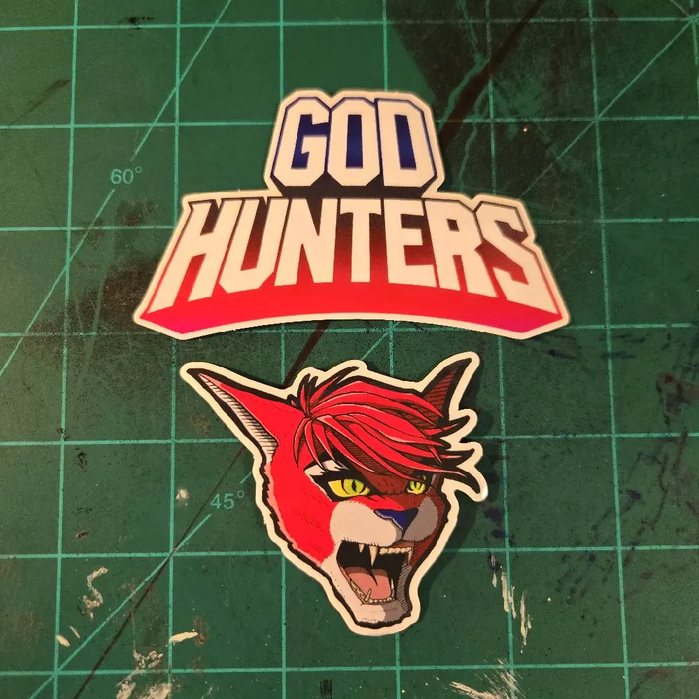 GOD HUNTERS Sticker pack w/ 2.5"×4" God Hunters logo and a 3"x3" Akiya raging head