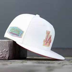 Los Angeles Dodgers New Era 9FORTY Snapback Baseball Cap – Black, flat brim, white LA logo and commemorative badge on the side, MLB streetwear accessory.