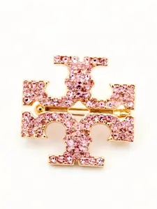 Pink rhinestone stacked T-shaped brooch with gold-tone finish, sparkling crystals, perfect for coats, bags, and scarves, adding a touch of elegance.