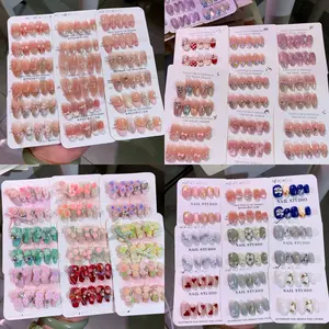 30 pairs of pure handmade nail art, featuring various fashionable designs such as rhinestones, hearts, and patterns, covering nude, pink, and mixed colors. Suitable for various occasions, reusable, easy to stick and durable for 30 days of wearing. Comes w