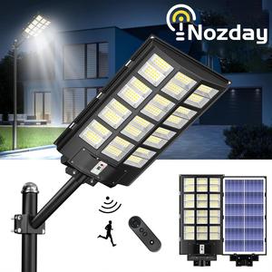 Nozday 9800W MAX  IP67 Solar Street Lights Outdoor,6500K 480000LM Highest Lumen Solar Parking Lot Lights,Waterproof Duks to Dawn Solar Flood Security Lights Motion Sensor for Yards, Driveways