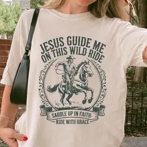 Jesus Guide Me On This Wild Ride Shirt Western Christian Cowgirl Faith T-Shirt Rustic Bible Verse Christian Shirt Religi Everyday Cotton T-Shirt