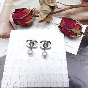 Pre-owned Chanel Gold Tone Pearl CC Silver Earrings T10270770