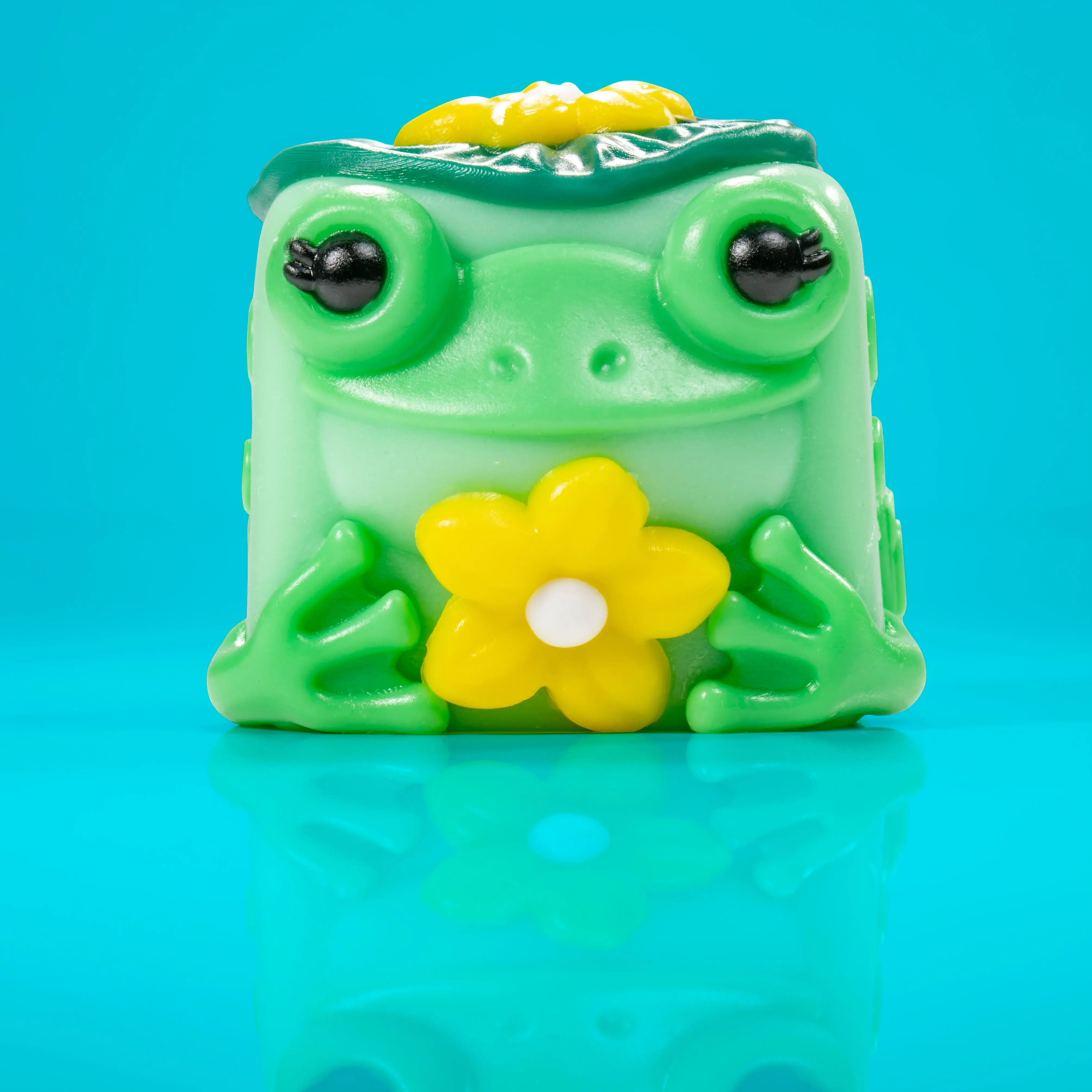 Lily the Frog - Adorable Teal Flower Gardener with Yellow Petals & Green Cabin Design - Inspired by Nature & Peaceful Forest Vibes Taba Squishy