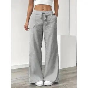 Elegant women’s striped straight-leg pants with an elastic waistband, vertical stripes, and side pockets—comfortable for year-round wear