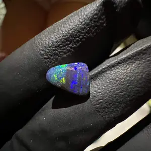Australian cabbed opal with rainbow striped play of color