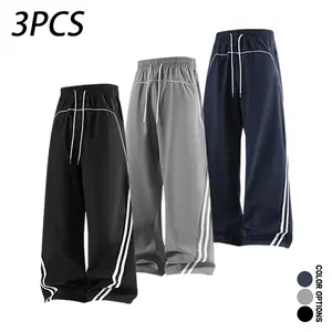 Pack of 3 men’s casual long pants for spring and autumn featuring a deconstructed color-block striped patchwork design, a loose fit with a drawstring elastic waistband—versatile for everyday wear, leisure, sports, and fitness.