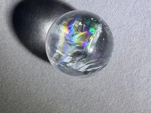 Natural clear quartz ball with a rainbow inside