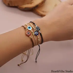 "Evil Eye" Bracelet — Light Luxury Cord & Gold Bead Wristwear: Exquisite, Versatile, and Sophisticated — A Trendy Accessory