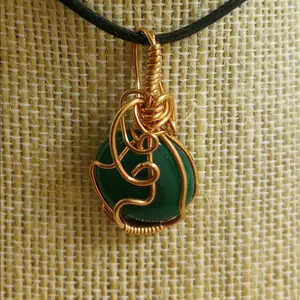 Dark green adventurine pendant in copper wrap