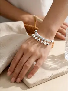 One Vintage Bell Bracelet an adjustable open-cuff bangle featuring dangling beaded pendants. Perfect for holidays, beach outings, and everyday wear, it makes an ideal birthday or Bohemian-style gift.