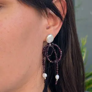 Red garnet bow earring with freshwater coin pearl. Sterling silver