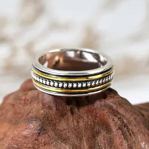 Bohemian Two-Tone Meditation Ring: Featuring a two-tone metal design, this casual, versatile, and unisex ring is an ethnic-inspired accessory with a distinctive vintage, distressed finish.