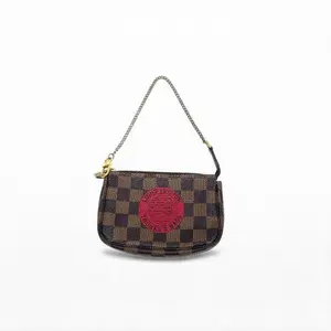 Pre-owned Louis Vuitton Coated canvas with leather trim Crossbody Bags Pochette Accessoires Brown Damier Ebene with red Game On motif Good S012260225137