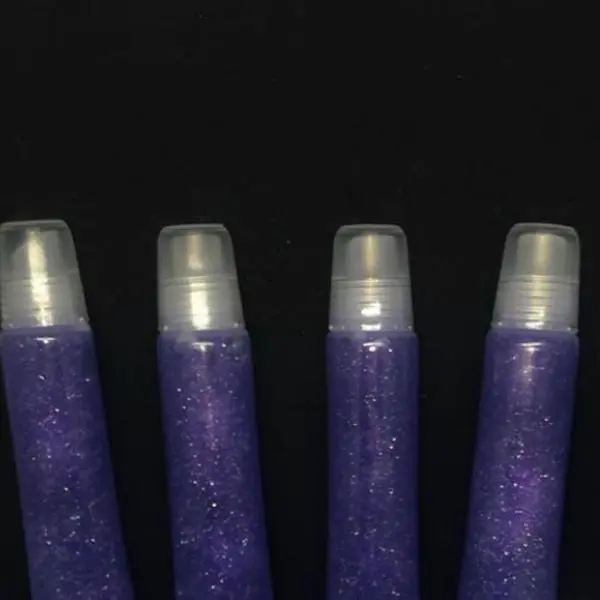 Long squeeze tube signature purple glitter lip gloss