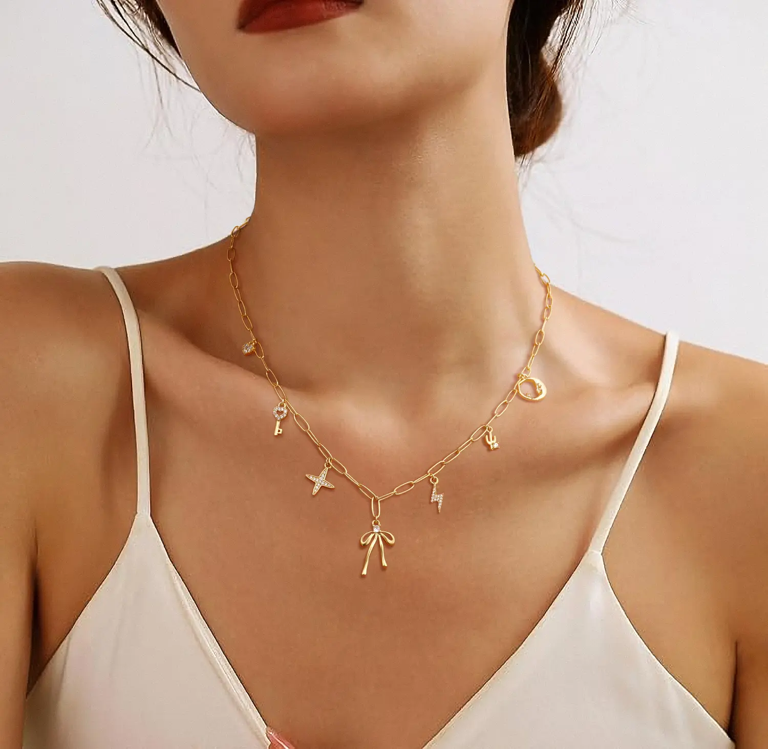 Loyalove  14K Gold Plated Multi Charm Necklace for Women, Dainty Paperclip Chain with Bow, Moon, Star, Heart Key and Lightning Charms, Adjustable Hypoallergenic Jewelry