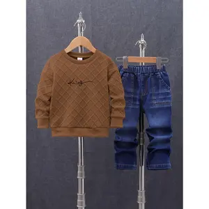 A Two-Piece Set for Boys Featuring a Textured Fabric Sweatshirt with a King Print And a Round Neck, Paired with Casual Denim Pants That Have an Elastic Waistband And Slanted Pockets, Suitable for Spring And Autumn, for Outdoor