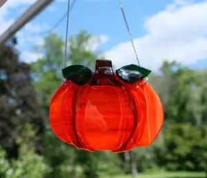 Orange Pumpkin suncatcher, fused glass on a 7 inch steel hanging chain