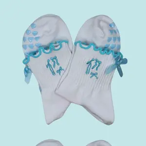 Light blue bow coquette grip socks with bow embroidery and heart grips for pilates, barre, yoga and lagree