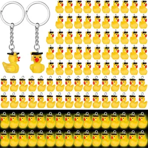 Ecation 100 Pcs Graduation Luminous Mini Duck Keychains 2026 Graduate Resin Duck Gifts Glow in the Dark Keychains 3D Yellow Tiny Key Chains Bulk Small Animal Pendant Accessories for Graduation Party