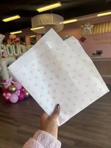 White tissue with pink bows printed 🎀