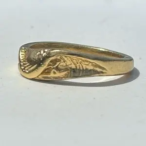 The 18k gold Wet Dreams Ring by Strickly Boarding and Joe Paradise.  The undisputed leader in custom surf jewelry. Made in the USA.
