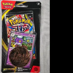 Pokémon TCG Mega Evolution Booster pack with 1 promo card and 1 Pokémon coin