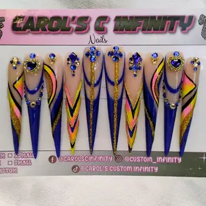 Carol's C Infinity 5XL Stiletto Nails with Blue, Yellow, and Gold Accents and Rhinestones