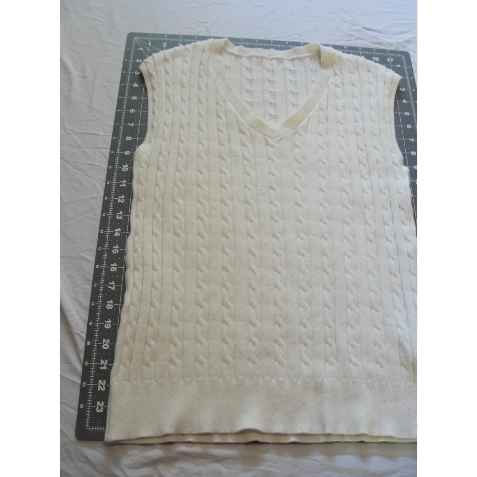 Cream-colored  cable knit V-neck sweater vest size medium