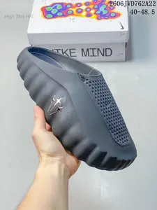 Matte Dark Gray Integrated Soft EVA Foam Slip On Clogs Forefoot Dense Dot Perforated Breathable Patch Segmented Wavy Contour Body Metallic Silver Three Star Embossed Logo Waterproof Casual Slides For Gym Pool Beach Shower