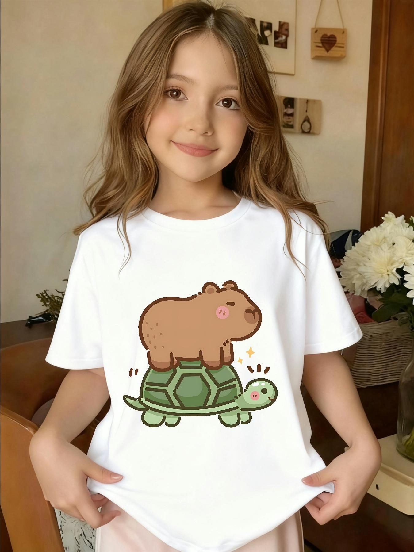 1Girls' T-shirt with Funny Cartoon of Kapi Riding a Turtle |   Casual Knit Top, Crew Neck, Regular Fit, Medium Stretch Fabric, Perfect Gift for Little Ones, All-Season Wear