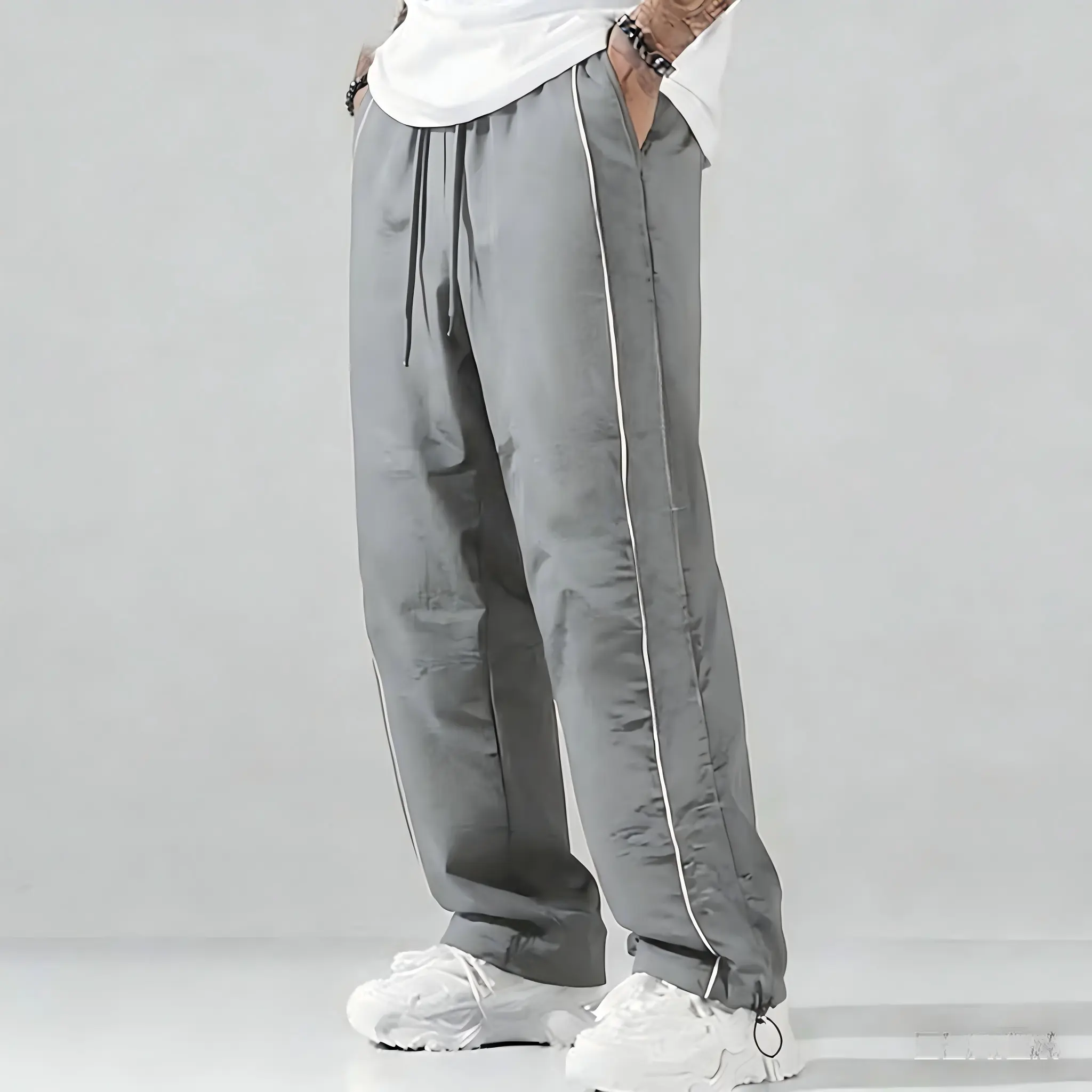 Upgraded version — men’s summer loose sports pants made from lightweight, soft fabric; available in large sizes; white side stripes; comfortable casual athletic design for gym wear in spring.