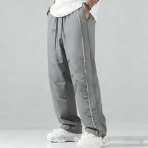 Upgraded version — men’s summer loose sports pants made from lightweight, soft fabric; available in large sizes; white side stripes; comfortable casual athletic design for gym wear in spring.
