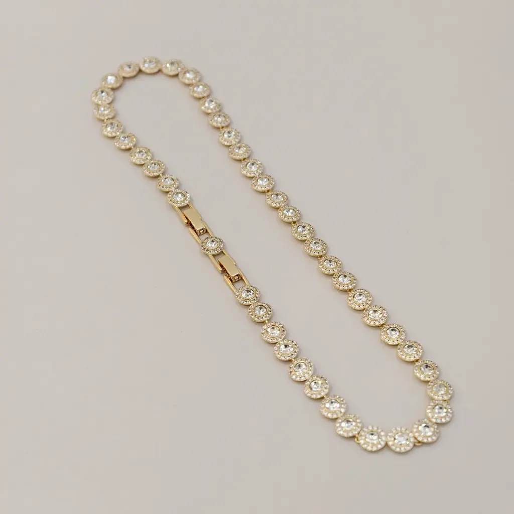 Gold colored full diamond button necklac