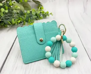 Silicone Wristlet With Wallet - Gray Color, Tassel Accessory, Clip Attachment, Compact Design, Ideal for Everyday Use
