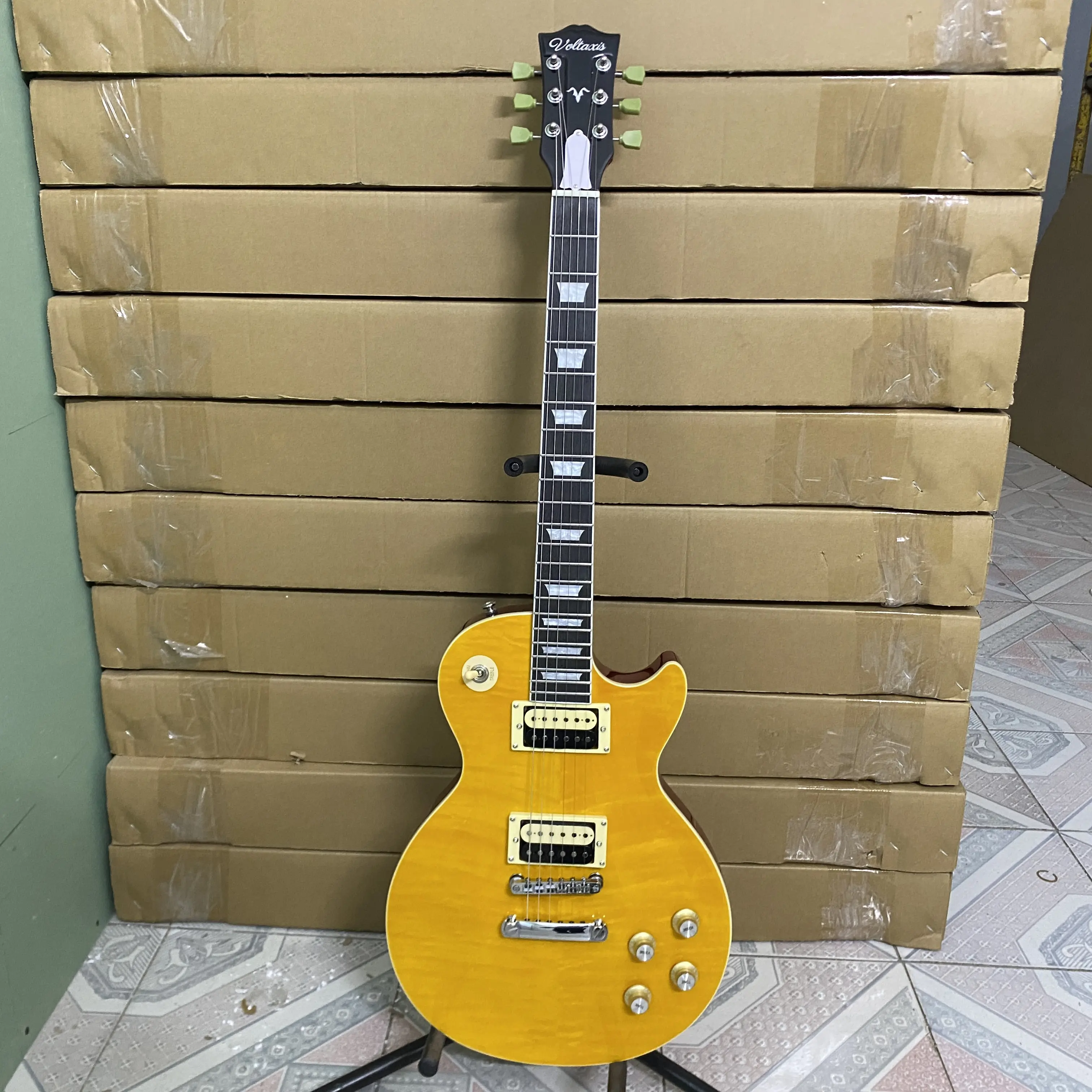 Yellow 6-string electric guitar, zebra pickup, flame maple top, chrome hardware, rosewood fretboard, 22 frets