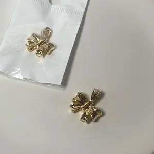 Coquette Ribbon Pendant Color Gold Goldfilled with Elegant Design and High-Quality Finish