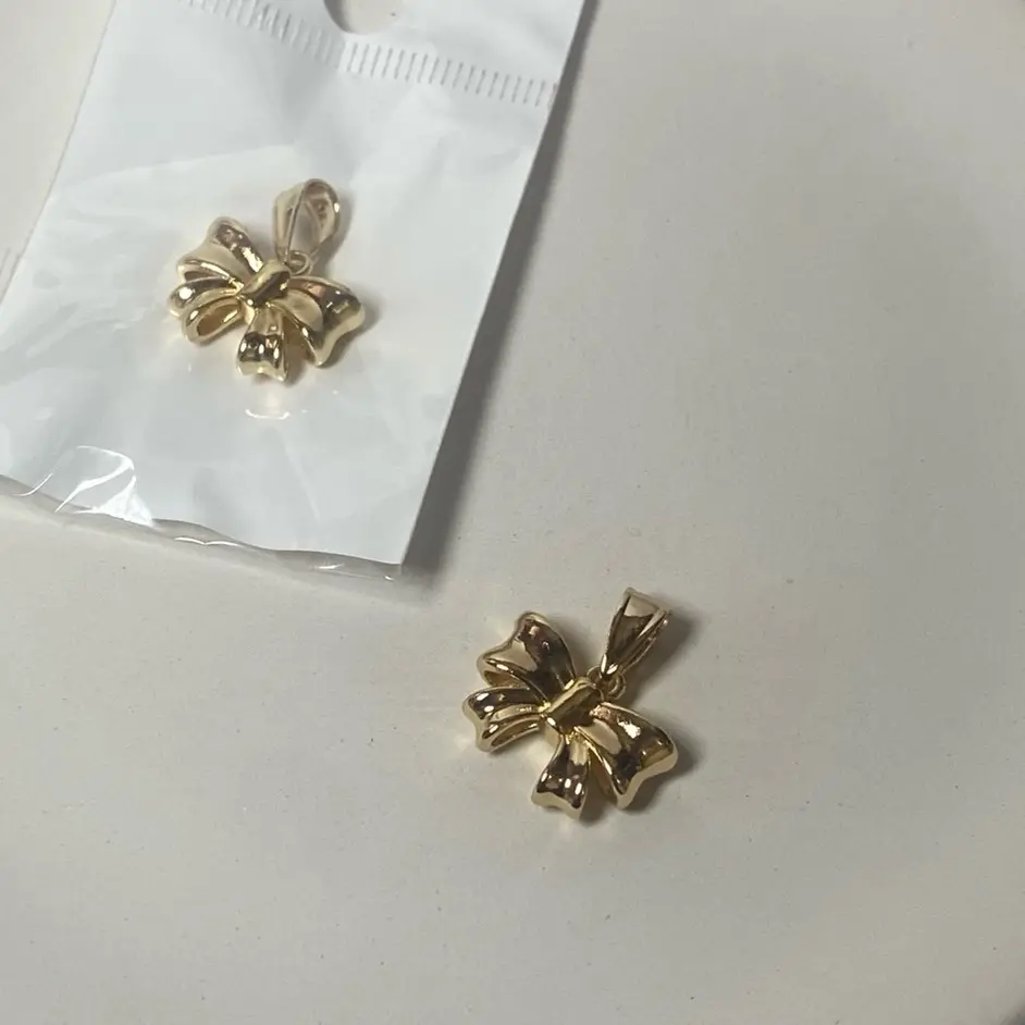 Coquette Ribbon Pendant Color Gold Goldfilled with Elegant Design and High-Quality Finish