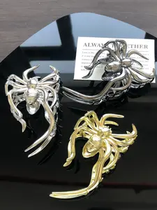 Three-piece set of metal-colored spider-shaped horror-themed Halloween decorations for women, featuring a half-up hairstyle at the back of the head, perfect for festive parties
