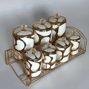 7-Piece Luxury White & Gold Abstract Organic Ceramic Canister Spice Jar Set with Air-Tight Crystal Knob Lids and Storage Stand for Home Organization