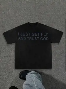 Black Oversized Tee With ‘I Just Get Fly And Trust God’ Slogan — Edgy Religious Streetwear! Subtle Tone-On-Tone Typography, Distressed Finish & Relaxed Fit For Urban Cool. Perfect For Casual Layering Or Bold Solo Styling.