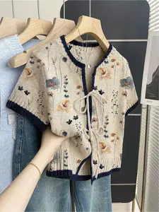 Women's khaki bohemian vacation short-sleeve knit top. Loose round neck, contrast floral gradient print, front tie and contrast piping. Comfortable for spring & summer casual wear. Womenswear