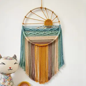 A Macrame Wall Hanging in a Bohemian Style, Featuring a Dreamcatcher Design, Perfect for Decorating a Background Wall Or Headboard.