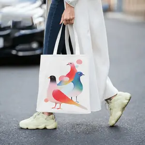 This canvas tote bag features three gradient-colored doves as the design theme, combining artistic beauty with the meaning of peace. Made of high-quality canvas fabric, it is lightweight and durab